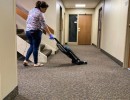 lady vacuuming building